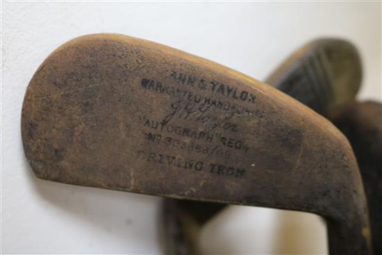 Two wooden drivers by Armstrong & Co and Paxton, a gun metal putto signed Jacques, 7 other and a golf ball
